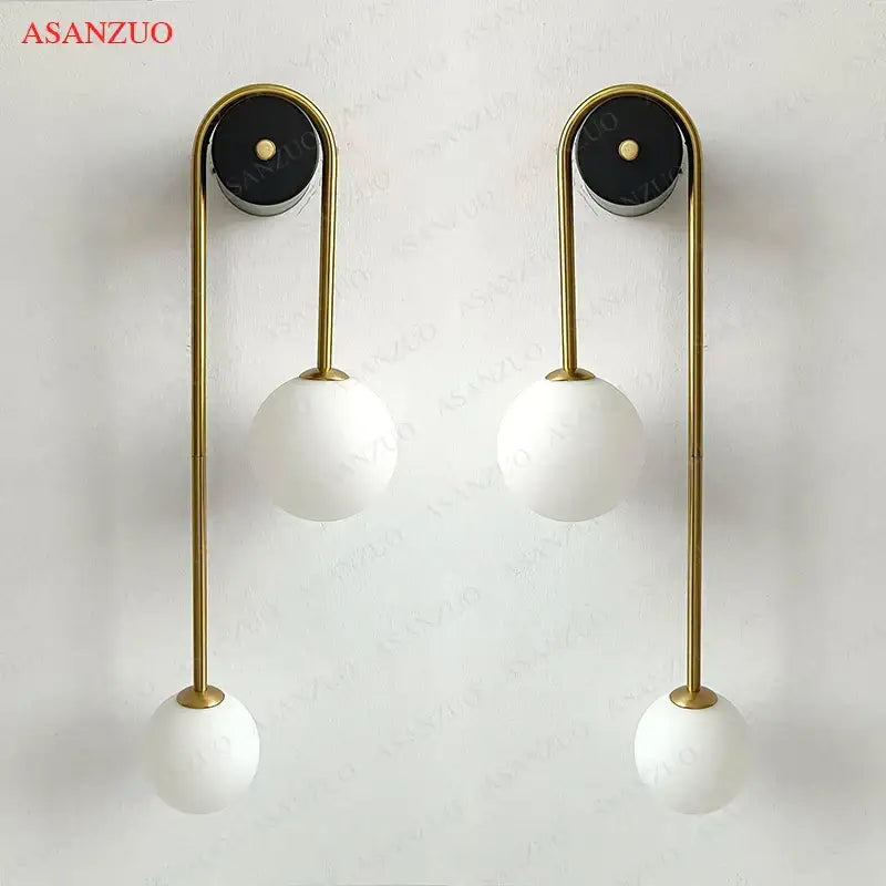 Modern gold glass ball wall lamp with frosted glass shades and black mounts for bedroom decorbites glass ball sconce