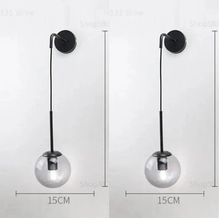 Modern black metal wall lamp with clear glass ball shade for bedroom decorbites glass ball sconce lighting