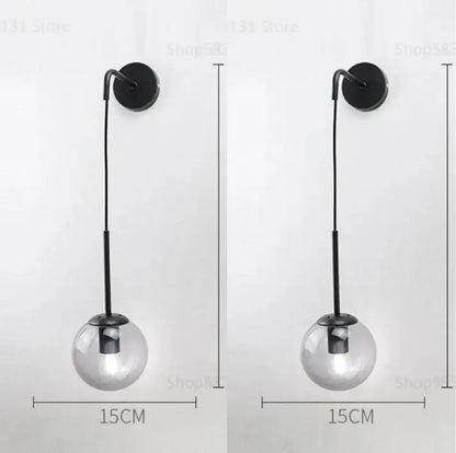 Modern black metal wall lamp with clear glass ball shade for bedroom decorbites glass ball sconce lighting