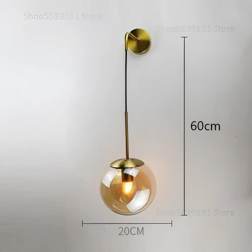 Modern gold glass ball wall lamp with brass finish and amber glass globe decorbites glass ball bedroom sconce