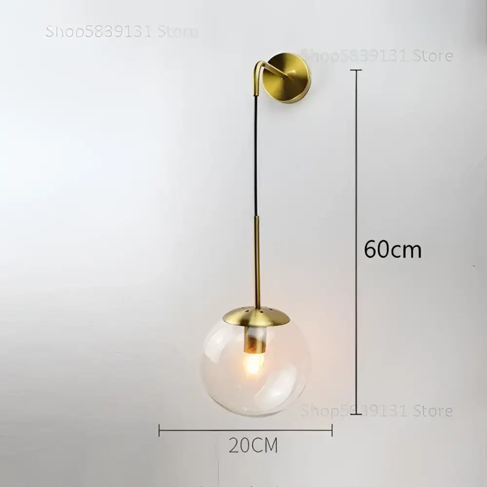 Modern gold glass ball wall lamp with brass finish and clear glass globe for elegant bedroom decorbites glass ball lighting