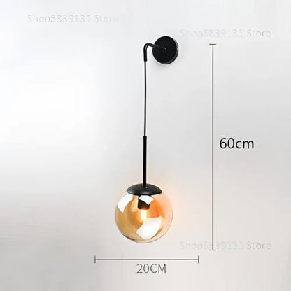 Modern black metal wall lamp with 20cm amber-tinted glass ball for stylish decorbites glass ball bedroom sconce