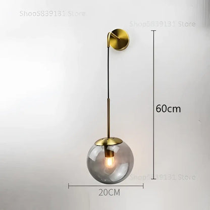 Modern gold glass ball wall lamp with brass finish and spherical glass ball by decorbites for bedroom sconce lighting
