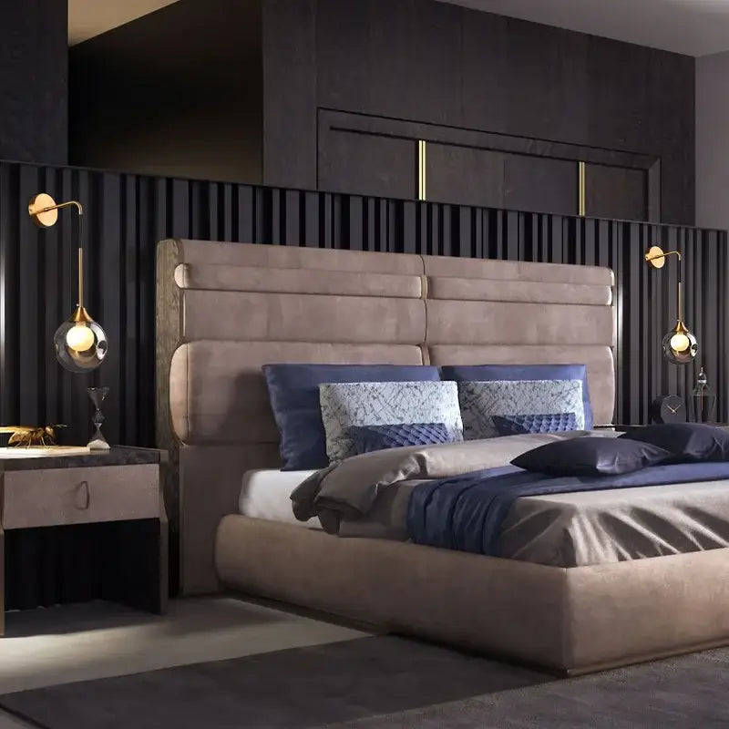 Beige upholstered bed with tufted headboard and navy bedding illuminated by modern gold glass ball wall lamp decorbites glass ball