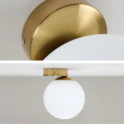 Modern gold glass ball wall lamp with frosted globe and sleek metallic base ideal for bedroom decorbites glass ball