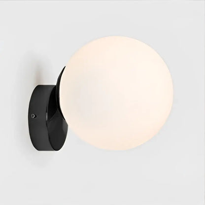 Modern gold decorbites glass ball wall lamp with black spherical sconce and frosted globe for bedroom decor