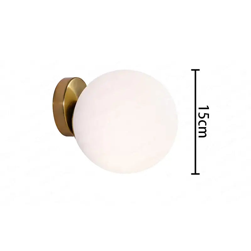Modern gold glass ball wall lamp with frosted white glass globe and brushed brass base for bedroom decorbites wall lamp