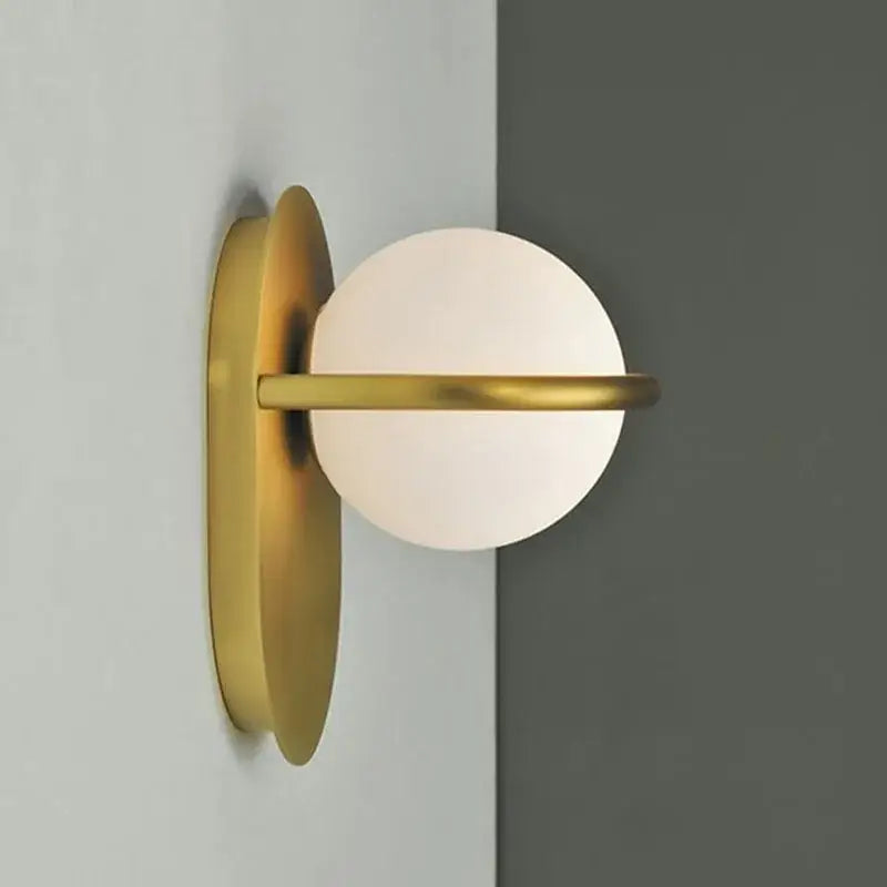 Modern gold glass ball wall light with frosted white glass shade and minimalist geometric decorbites glass ball design