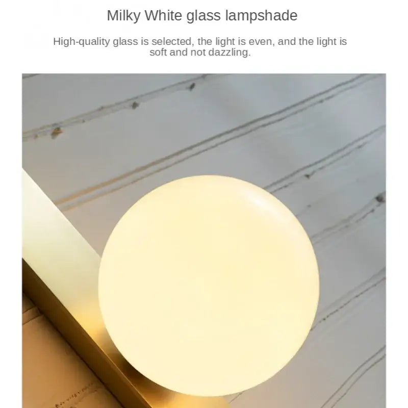 Modern gold glass ball wall sconce with milky white glass ball diffuser for soft bedroom lighting decorbites glass ball wall