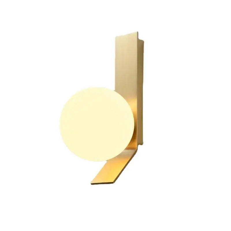 Modern gold-toned glass ball wall sconce with frosted glass diffuser and angular metal bracket for minimalist decorbites decor