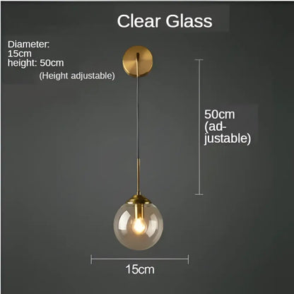 Modern gold glass ball wall sconce light fixture with adjustable clear glass globe and brass decorbites hardware for bedroom decor