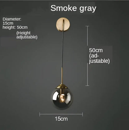 Modern gold glass ball wall sconce light fixture with smoke gray spherical pendant and brass-finished adjustable height decorbites glass ball decor