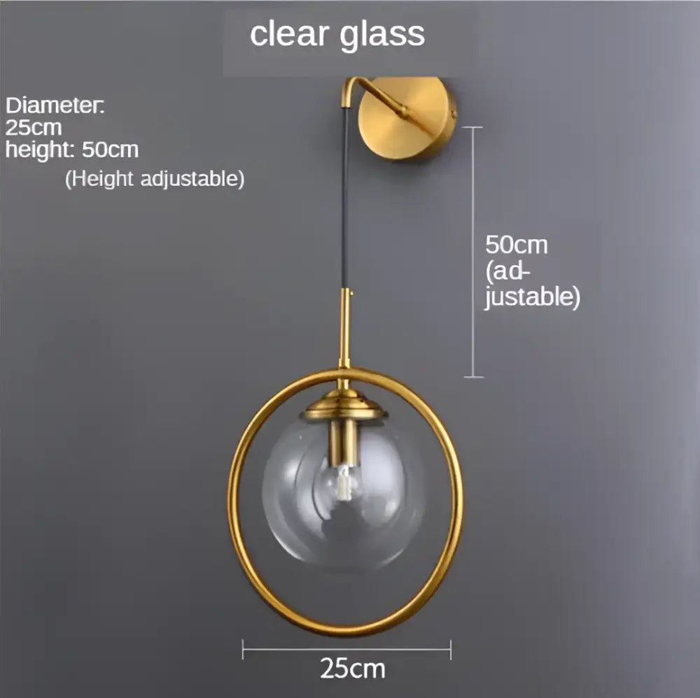 Modern gold glass ball wall sconce light fixture with adjustable height and clear glass globe by decorbites