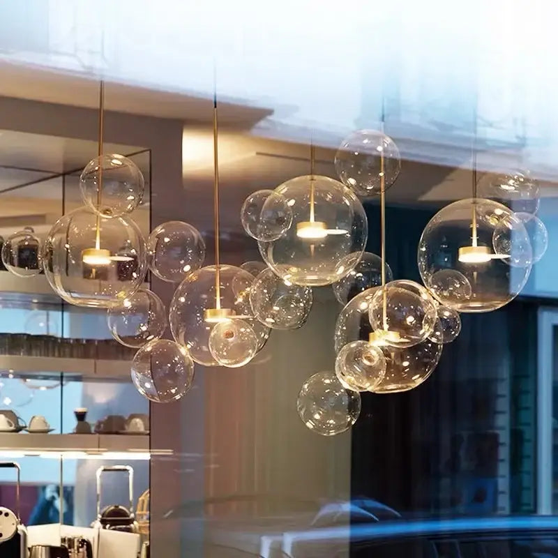 Modern gold glass bubble chandelier with clear glass bubbles and warm golden fixtures for dining room decorbites glass bubble lighting