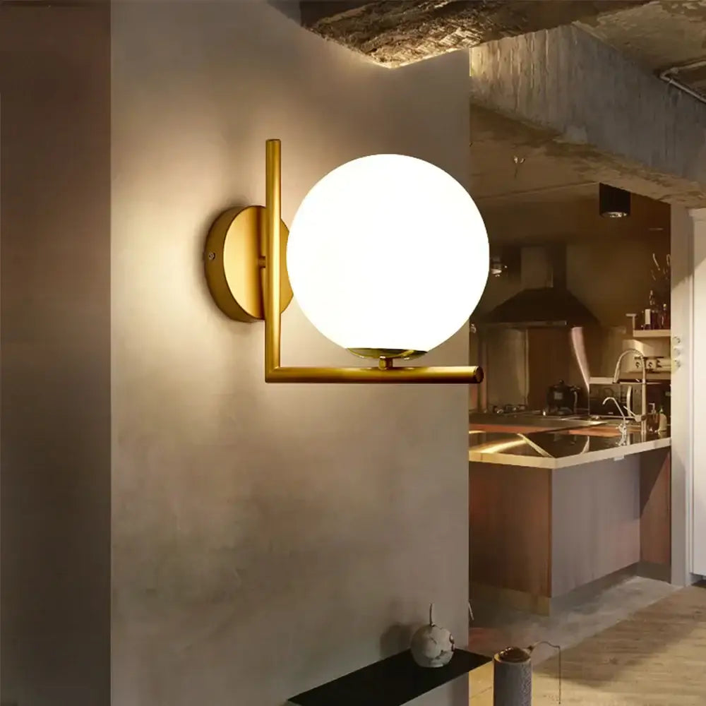 Modern gold glass globe wall lamp with a spherical frosted glass globe for bedroom decorbites glass globe wall lamp