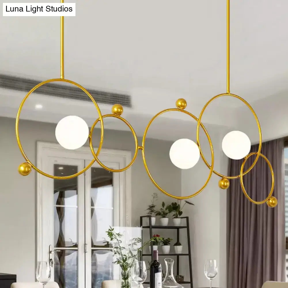 Gold-toned DecorBites™ contemporary 3-light glass ring island pendant with adjustable rods suitable for 220v-240v 110v-120v