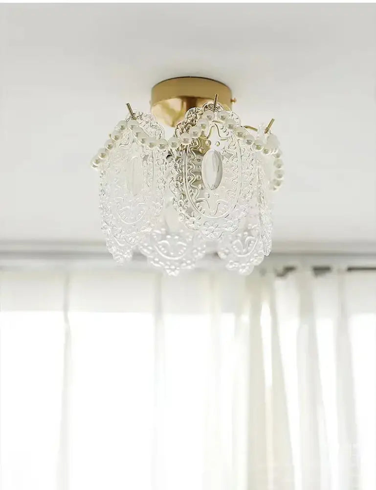 Delicate modern gold glass shade ceiling light with intricate lace-like patterns and pearl chandelier design