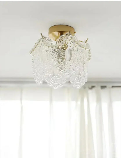 Delicate modern gold glass shade ceiling light with intricate lace-like patterns and pearl chandelier design