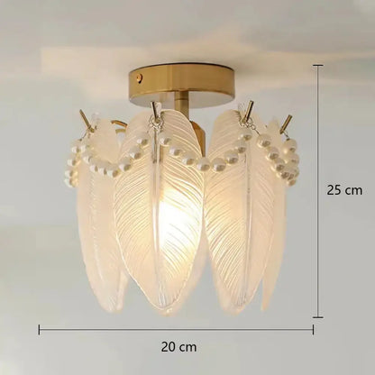 Modern gold glass shade ceiling light with feather-shaped glass shades and pearl details on a gold-toned base