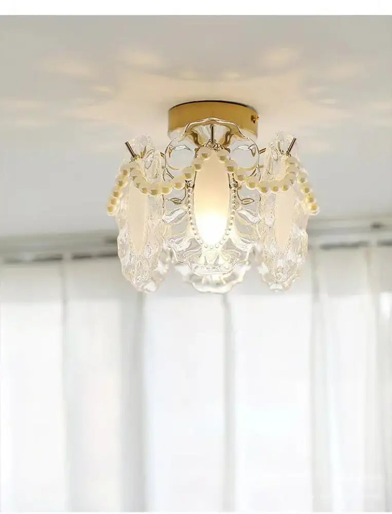 Elegant modern gold glass shade ceiling light with crystal chandelier and delicate pearl accents for balcony decor