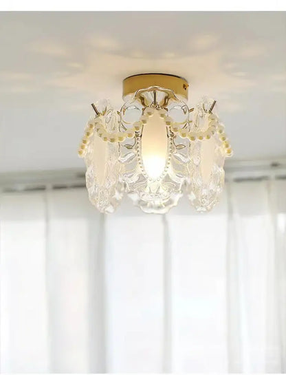 Elegant modern gold glass shade ceiling light with crystal chandelier and delicate pearl accents for balcony decor