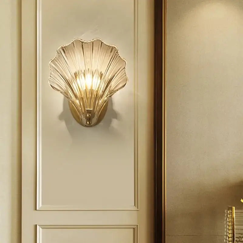 Modern gold glass shell led wall lamp featuring a translucent ribbed glass shade for elegant bedroom lighting