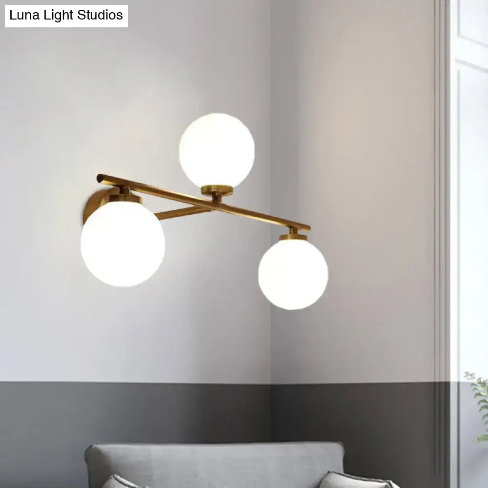 Modern gold wall lamp featuring three globe opal glass globes ideal for bedroom lighting sconce