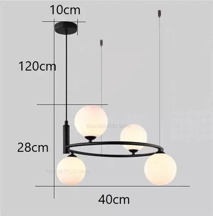 Modern black metal pendant light chandelier with four frosted glass globe lights for dining room use