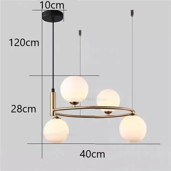 Modern gold pendant light chandelier with three frosted glass globes suspended from a brass-toned circular frame