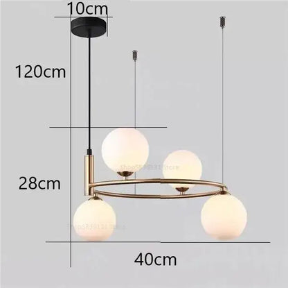 Modern gold pendant light chandelier with three frosted glass globes suspended from a brass-toned circular frame
