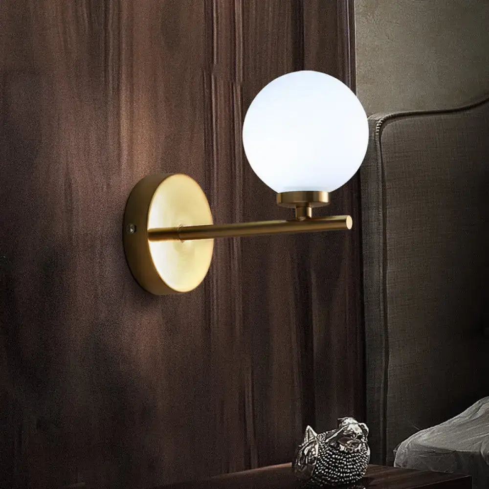 Modern gold globe shade wall sconce with opal glass suitable for led incandescent fluorescent washroom lighting
