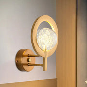 Modern gold globe wall lamp with clear bubble glass globe emitting warm light for bedroom 110v-120v use
