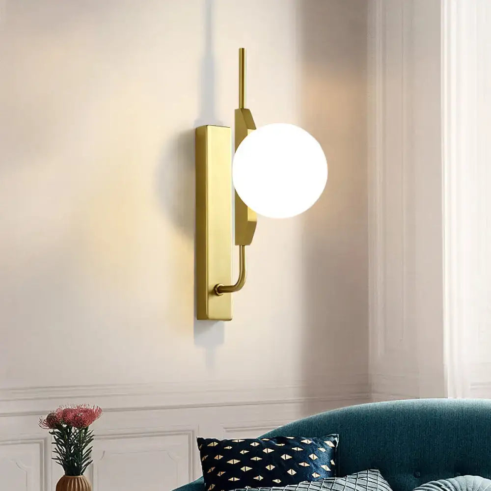 Modern gold globe wall sconce with frosted glass globe and sleek backplate for 110v-120v or 220v-240v lighting