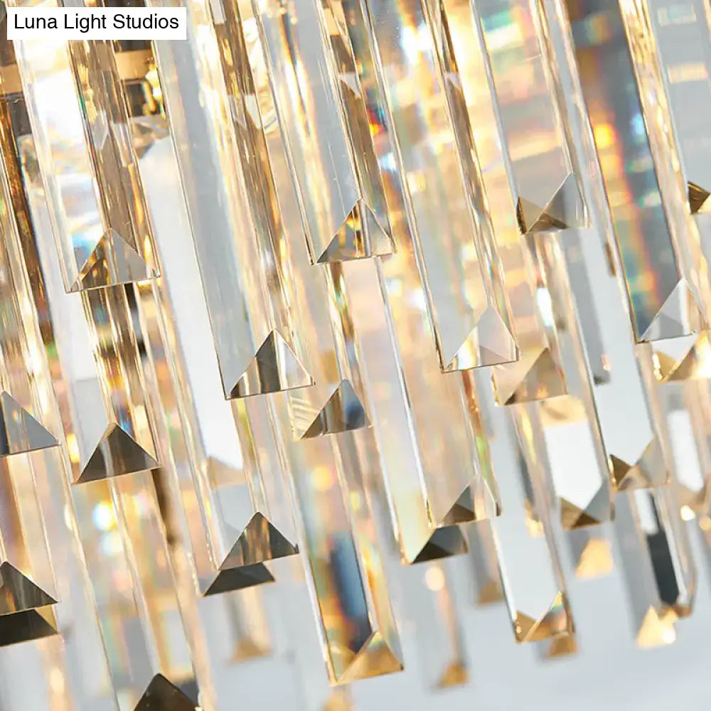Modern gold and gray crystal light fixture with clear faceted prisms and triangular cutouts for 220v-240v use