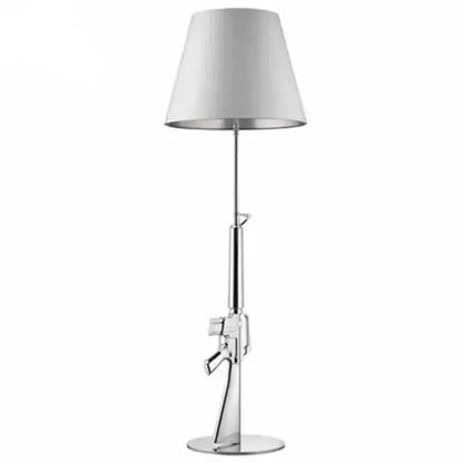 Chrome-finished gun floor lamp with white conical shade for modern gold decorbites gun floor living room decor