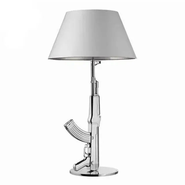 Modern gold gun floor lamp with chrome-finished ak-47 design and white conical shade for stylish gun floor lamp decorbites decor