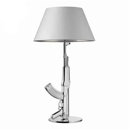 Modern gold gun floor lamp with chrome-finished ak-47 design and white conical shade for stylish gun floor lamp decorbites decor