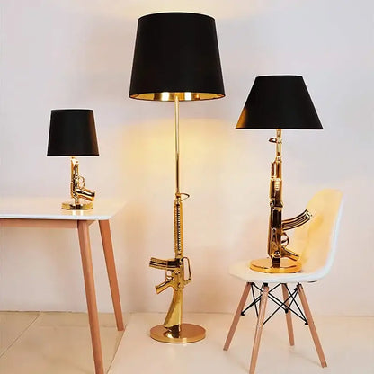 Modern gold gun floor lamp shaped like an ak-47 with black drum shade for living room decorbites gun floor light