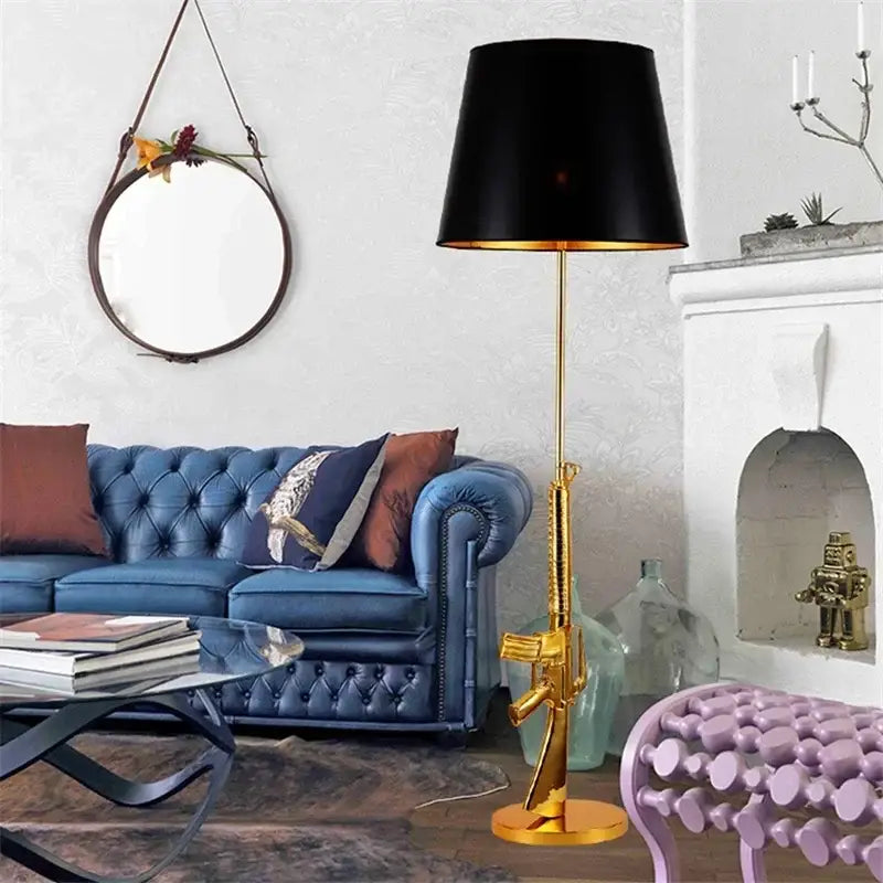 Golden rifle-shaped floor lamp with black drum shade by decorbites gun floor lamp for modern living room decor