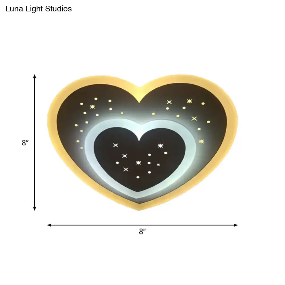 Modern gold heart pendant wall light with black rhombus star center and glowing white ring for bedroom use