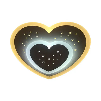 Modern gold heart pendant wall light with glowing inner ring and starry black center featuring rhombus star design