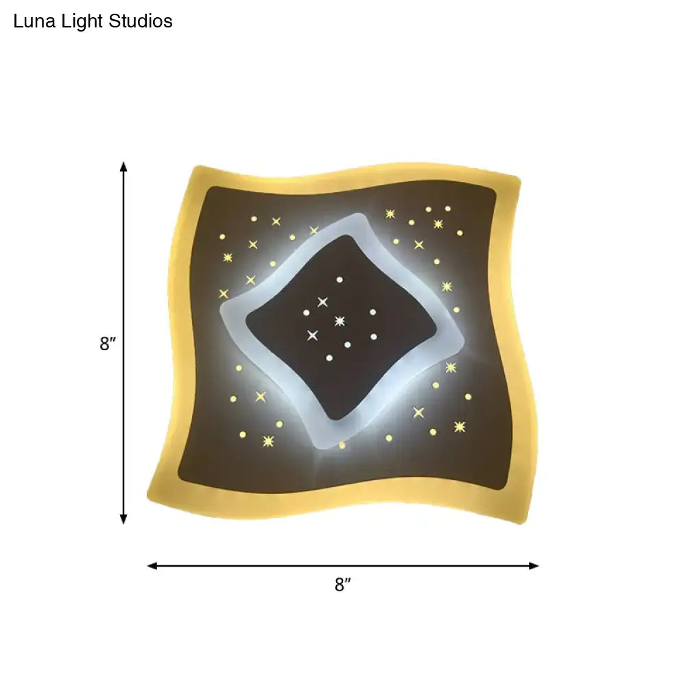 Modern gold heart pendant wall light with glowing white starburst rhombus star pattern on dark brown center panel