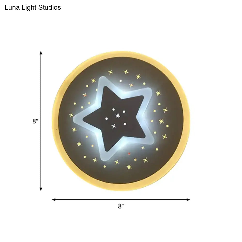 Modern gold heart pendant wall light with circular star-shaped glowing outline and dark starry center on black surface