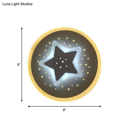 Modern gold heart pendant wall light with circular star-shaped glowing outline and dark starry center on black surface