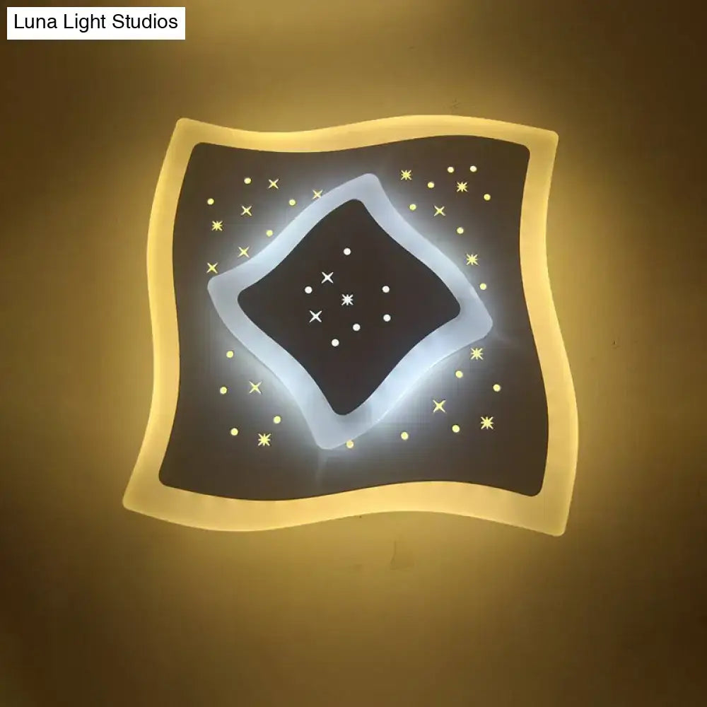Modern gold heart pendant wall light with dark starry black center and warm edges featuring a rhombus star design