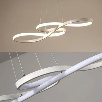 Modern gold infinity cord pendant light with sleek white rings and brushed nickel accents for dining room lighting