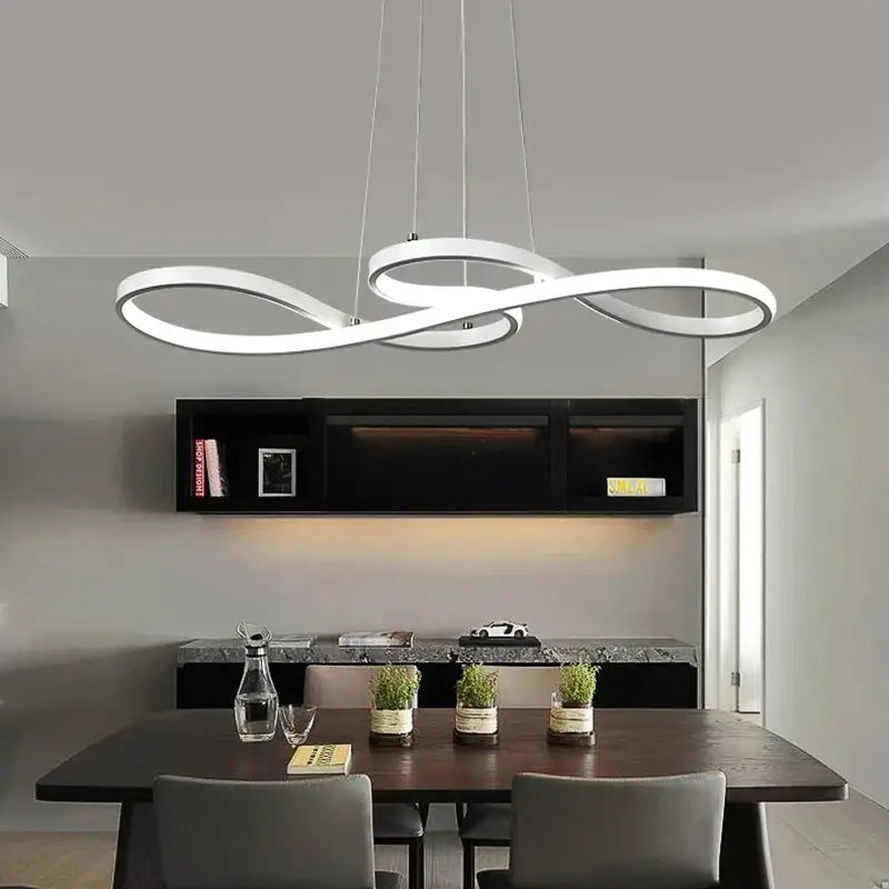 Modern white infinity-loop pendant light with sleek minimalist design featuring brushed nickel cord pendant for dining room