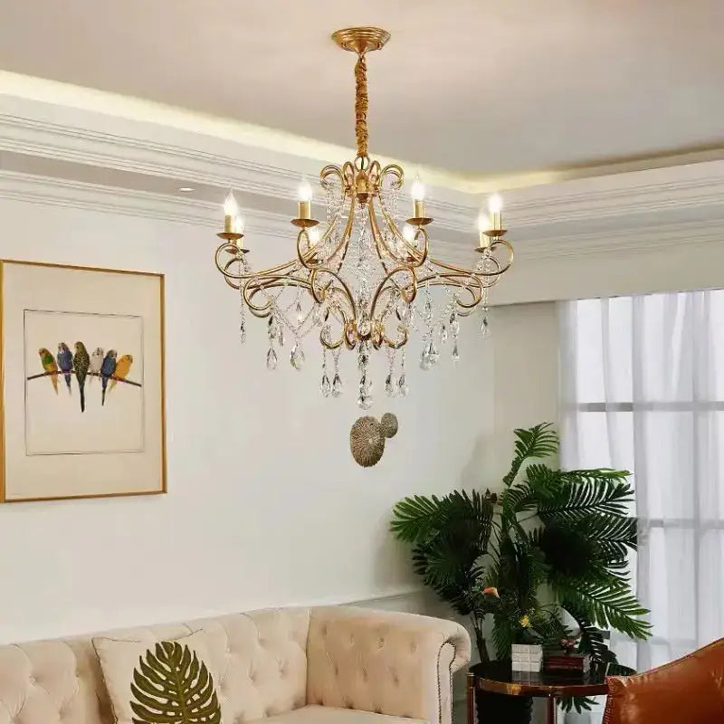 Modern gold iron crystal chandelier with intricate wrought iron design and dangling crystals for luxury dining decorbites iron crystal