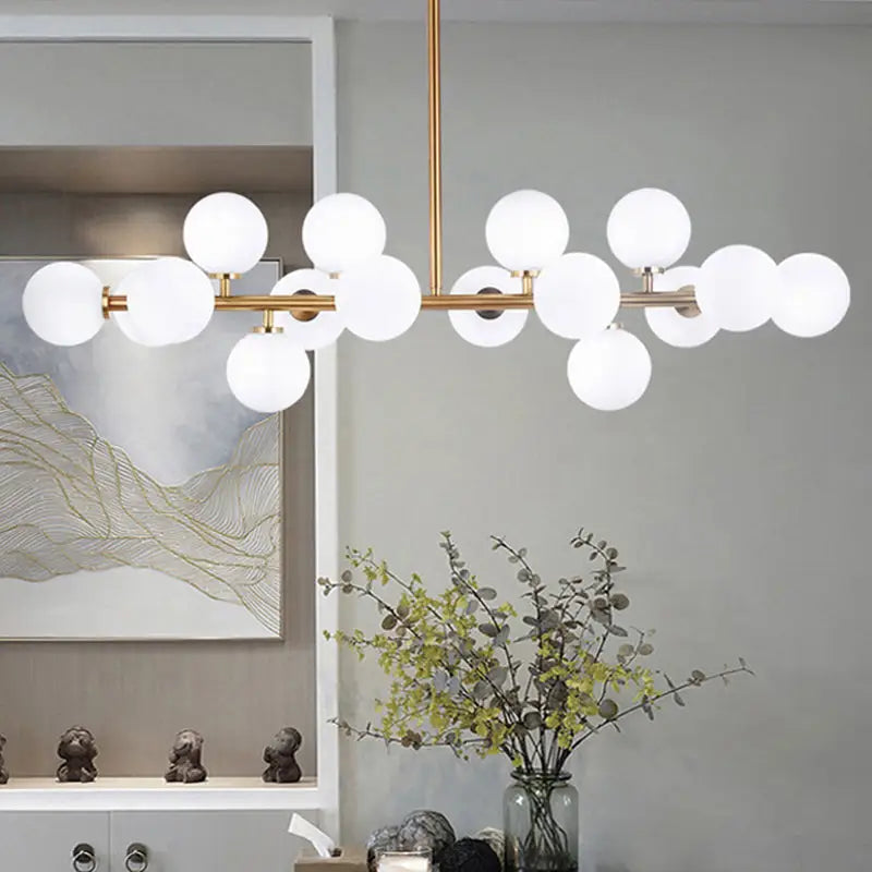 Modern gold island pendant light featuring a brass-toned chandelier with frosted glass globes 220v-240v 110v-120v