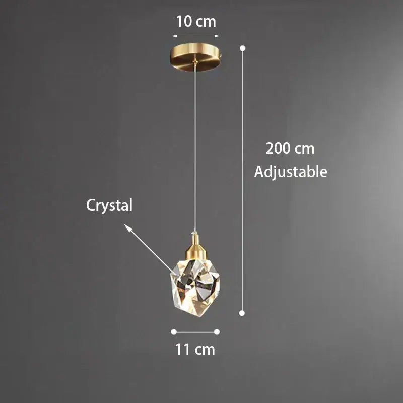 Modern gold k9 crystal linear kitchen pendant light with faceted crystal, gold-toned fixture, and adjustable chain for warm light 3200k